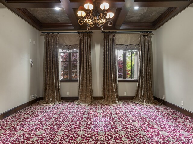 10910 S 69th E Ave, Tulsa, OK 74133 - spare room with coffered ceiling, carpet, crown molding, a chandelier, and beamed ceiling