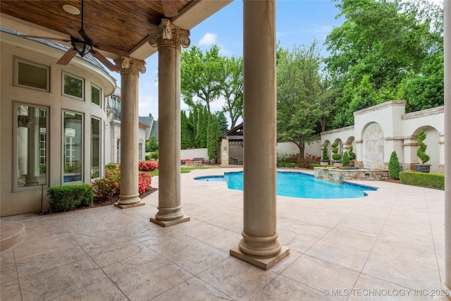 10910 S 69th E Ave, Tulsa, OK 74133 - view of swimming pool with ceiling fan, a patio, and a pool with connected hot tub