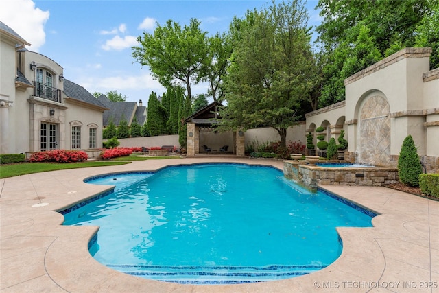 10910 S 69th E Ave, Tulsa, OK 74133 - view of swimming pool featuring a patio area, a fenced backyard, and a pool with connected hot tub