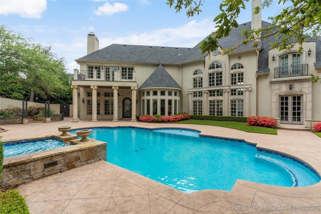 10910 S 69th E Ave, Tulsa, OK 74133 - view of swimming pool featuring french doors, a patio, and a pool with connected hot tub