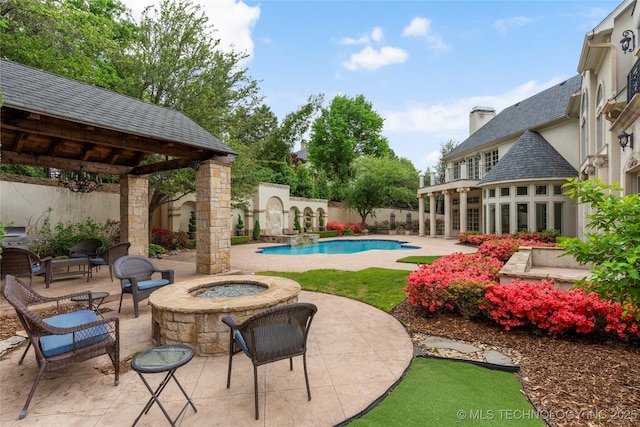 10910 S 69th E Ave, Tulsa, OK 74133 - view of pool featuring a patio, an outdoor fire pit, a gazebo, and a fenced backyard