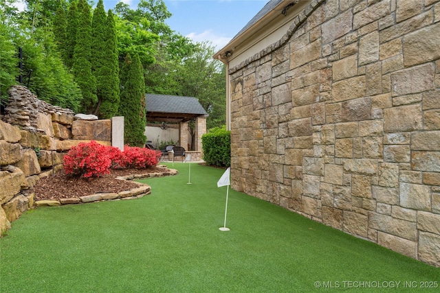 10910 S 69th E Ave, Tulsa, OK 74133 - view of yard featuring a gazebo and a putting area