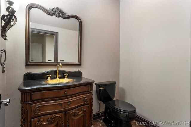 10910 S 69th E Ave, Tulsa, OK 74133 - bathroom with vanity and toilet