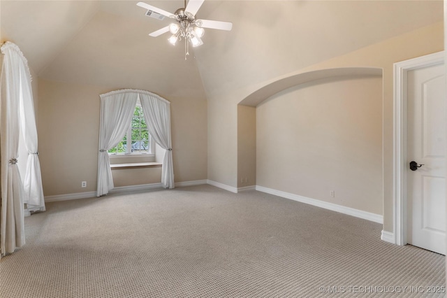 10910 S 69th E Ave, Tulsa, OK 74133 - additional living space with carpet, arched walkways, a ceiling fan, and lofted ceiling