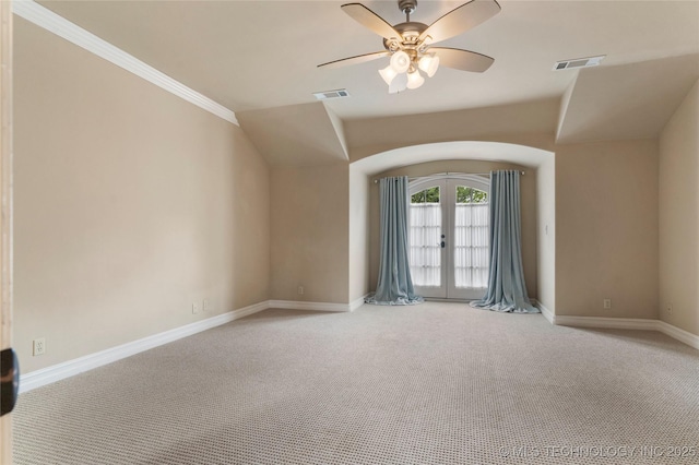 10910 S 69th E Ave, Tulsa, OK 74133 - spare room featuring light colored carpet, french doors, arched walkways, a ceiling fan, and ornamental molding