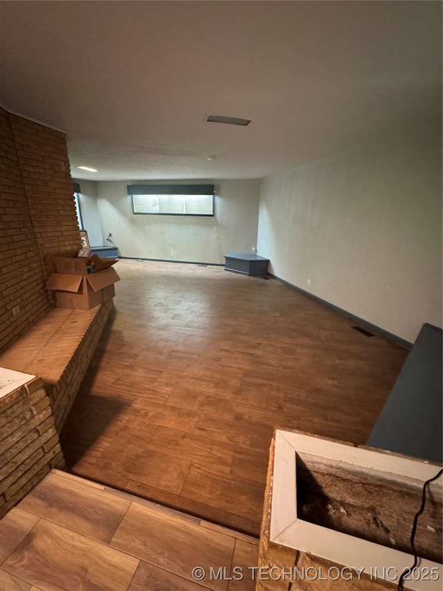 unfurnished living room with wood finished floors