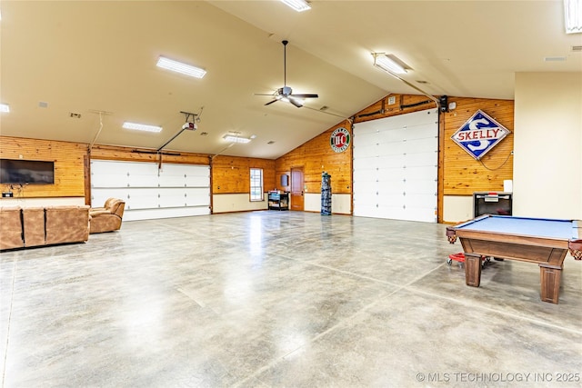 garage with wooden walls and ceiling fan