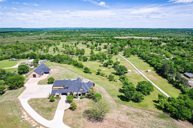 aerial view with a wooded view