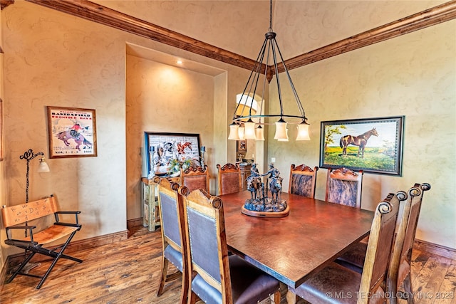 dining room featuring baseboards and wood finished floors