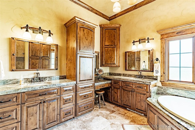 bathroom with a sink, crown molding, a bath, and two vanities