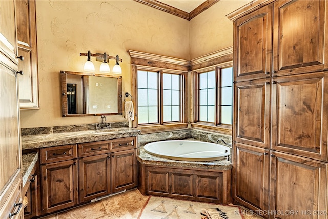 bathroom featuring vanity, a textured wall, crown molding, and a bath
