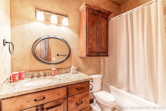 bathroom with vanity, shower / bath combination with curtain, and toilet