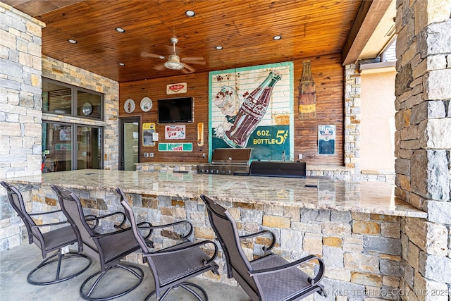 exterior space featuring ceiling fan and wooden ceiling