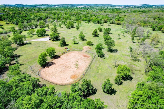 drone / aerial view featuring a forest view