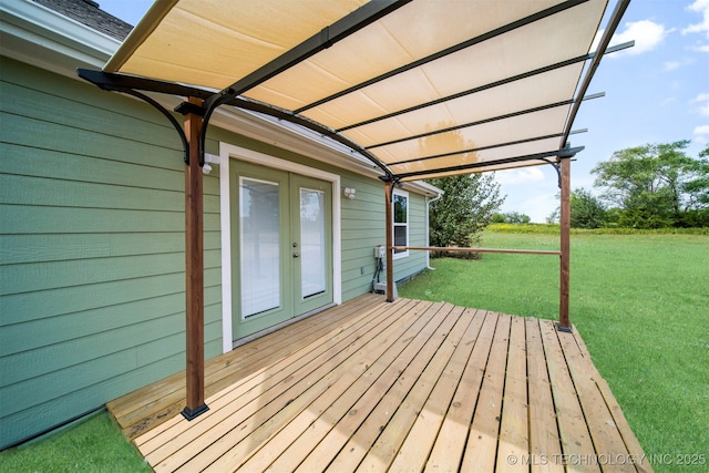 wooden deck with french doors and a yard