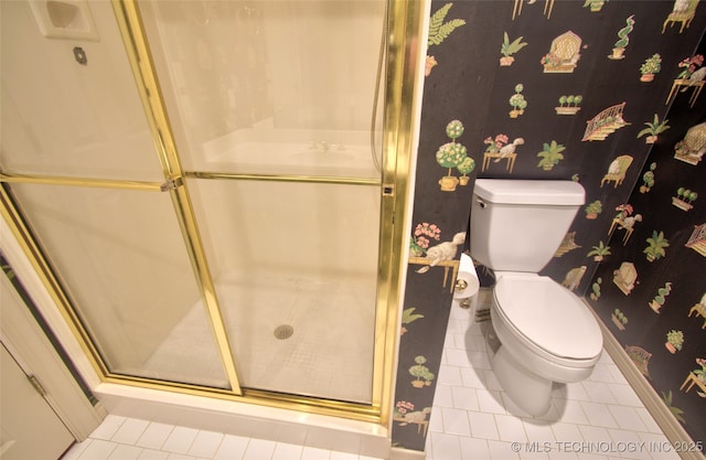 full bathroom with toilet, tile patterned flooring, and a stall shower