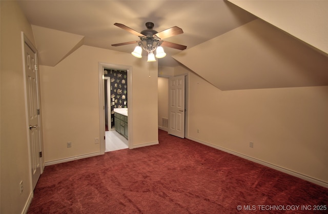 bonus room with carpet floors, ceiling fan, and baseboards
