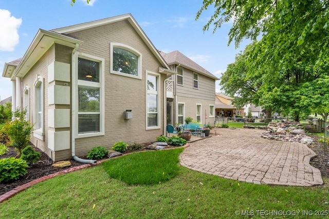 3401 N Narcissus Ave, Broken Arrow, OK 74012 - back of house with a patio and brick siding