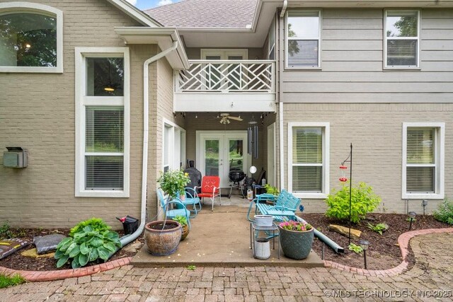 3401 N Narcissus Ave, Broken Arrow, OK 74012 - entrance to property featuring a balcony, french doors, brick siding, and a patio area