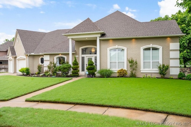 3401 N Narcissus Ave, Broken Arrow, OK 74012 - view of front of home featuring roof with shingles, a front lawn, an attached garage, and brick siding
