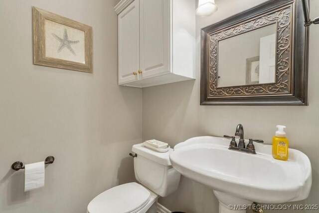 3401 N Narcissus Ave, Broken Arrow, OK 74012 - half bathroom featuring a sink and toilet