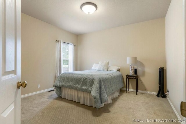 3401 N Narcissus Ave, Broken Arrow, OK 74012 - bedroom featuring light colored carpet and baseboards