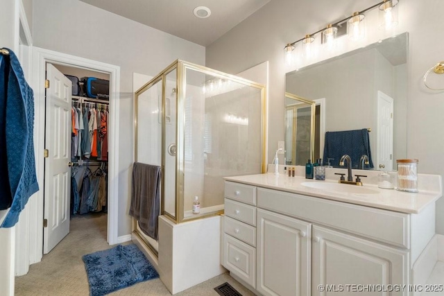 3401 N Narcissus Ave, Broken Arrow, OK 74012 - full bathroom featuring a shower stall, a spacious closet, and vanity