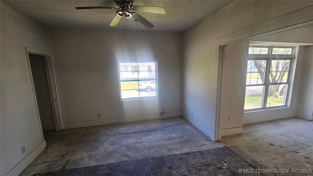 327 N G St, Muskogee, OK 74403 - spare room with a ceiling fan and a textured ceiling