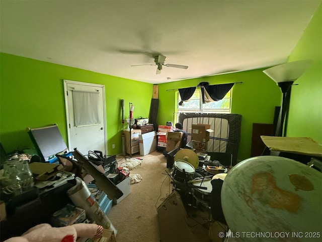bedroom featuring ceiling fan and light carpet