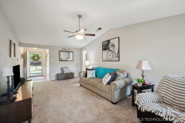 carpeted living room with ceiling fan, visible vents, and lofted ceiling