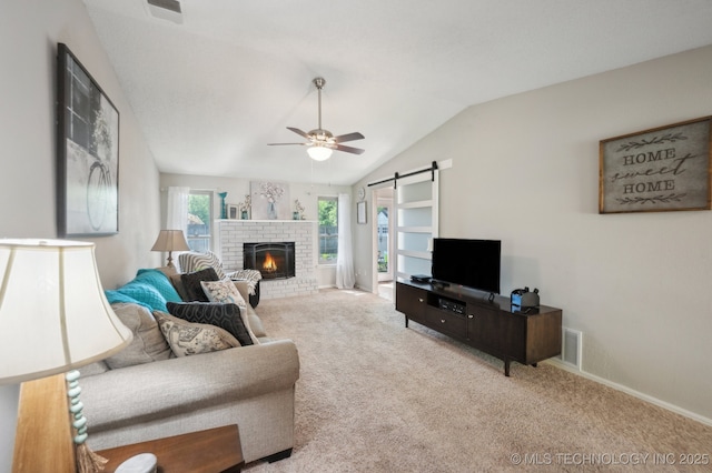 living area featuring visible vents, ceiling fan, carpet floors, and vaulted ceiling