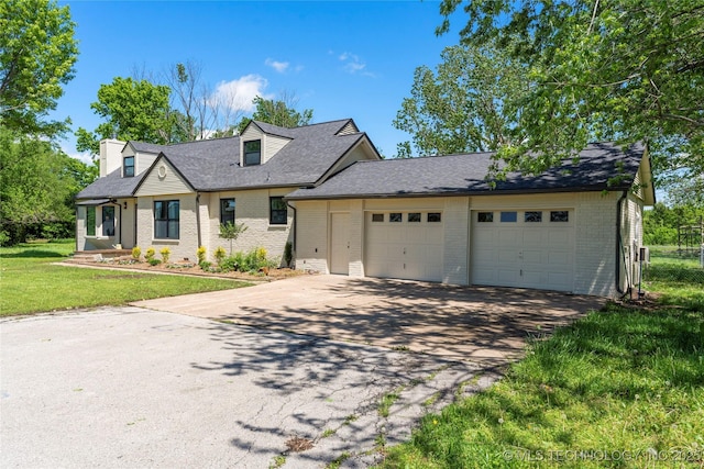 12415 N 75th E Ave, Collinsville, OK 74021 - cape cod home featuring brick siding, asphalt driveway, a garage, a front yard, and a shingled roof