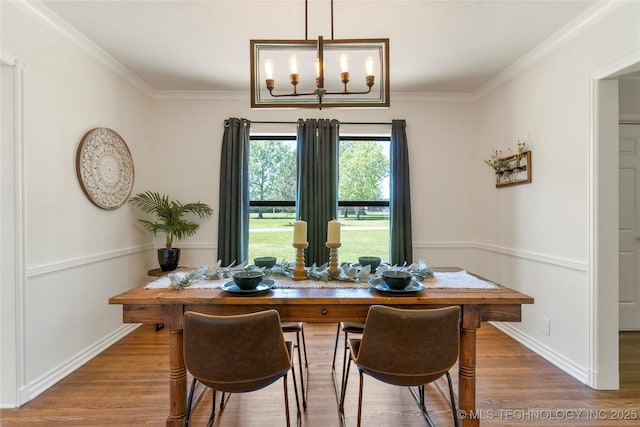 12415 N 75th E Ave, Collinsville, OK 74021 - dining space with wood finished floors, ornamental molding, and a chandelier