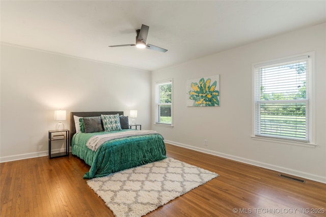 12415 N 75th E Ave, Collinsville, OK 74021 - bedroom with wood finished floors and ceiling fan