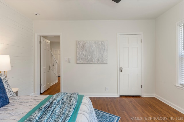 12415 N 75th E Ave, Collinsville, OK 74021 - bedroom featuring wood finished floors and wooden walls