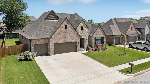 12509 S 102nd E Ave, Bixby, OK 74008 - french provincial home featuring a front lawn, fence, brick siding, a shingled roof, and driveway