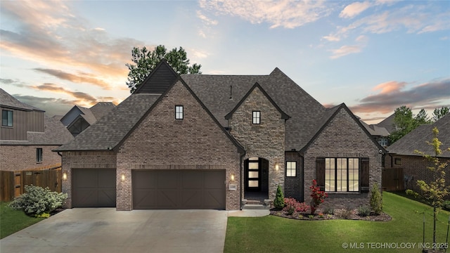 12509 S 102nd E Ave, Bixby, OK 74008 - french provincial home featuring brick siding, a lawn, fence, and concrete driveway