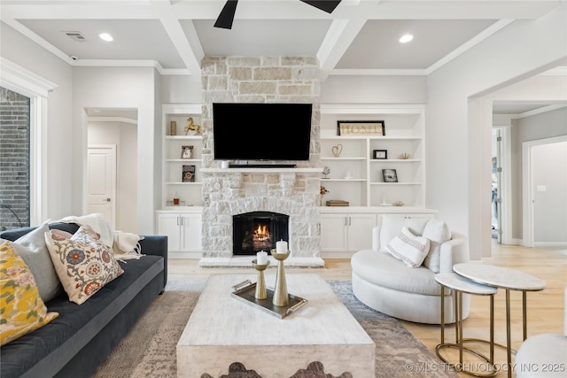 12509 S 102nd E Ave, Bixby, OK 74008 - living area featuring a stone fireplace, ornamental molding, light wood finished floors, and coffered ceiling