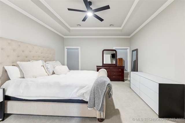 12509 S 102nd E Ave, Bixby, OK 74008 - bedroom featuring crown molding, visible vents, light colored carpet, a raised ceiling, and a ceiling fan