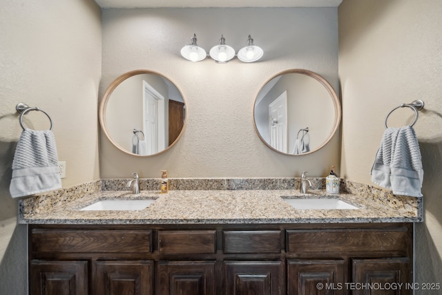 bathroom with double vanity and a sink