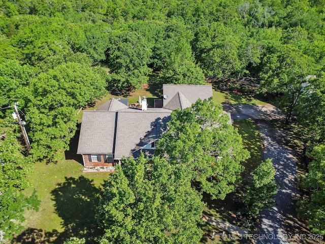 aerial view with a wooded view