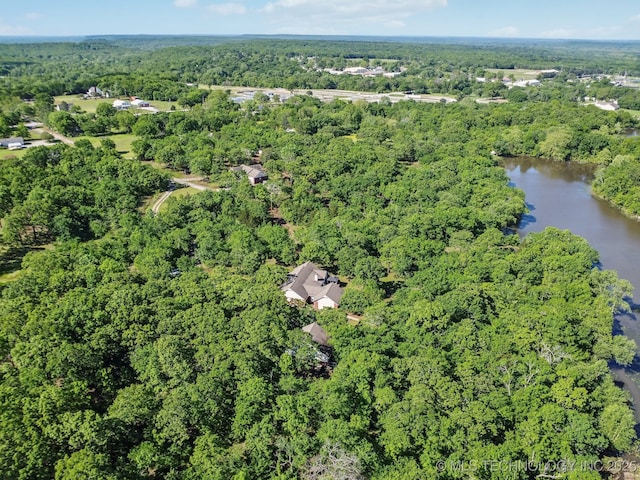 aerial view featuring a water view and a forest view