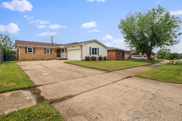 ranch-style home featuring concrete driveway, brick siding, a front yard, and a garage