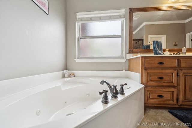 bathroom with vanity and a tub with jets
