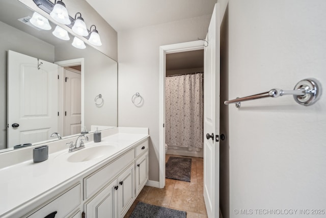 bathroom featuring a shower with curtain, tile patterned flooring, and vanity