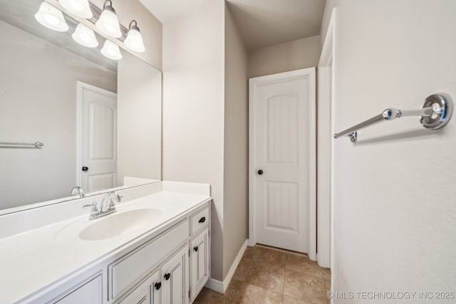 bathroom featuring baseboards and vanity