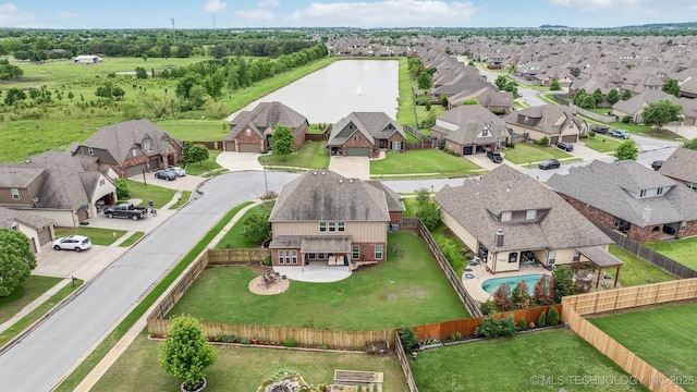aerial view featuring a water view and a residential view