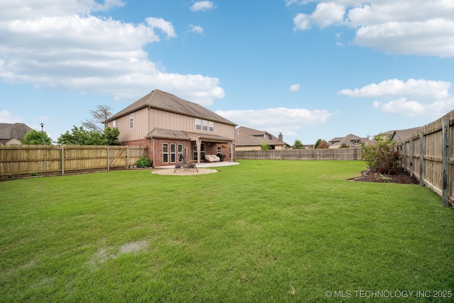 view of yard with a patio and a fenced backyard