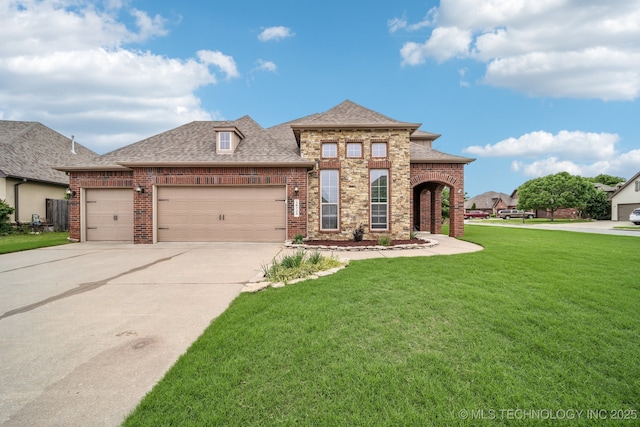 view of front of house with roof with shingles, a garage, brick siding, a front lawn, and concrete driveway