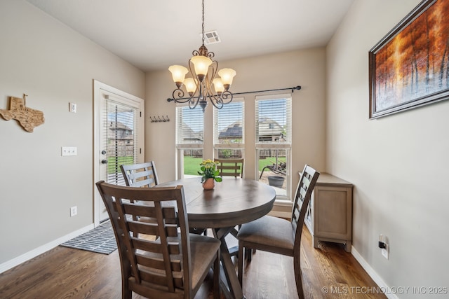 dining area featuring a healthy amount of sunlight, dark wood-type flooring, and visible vents